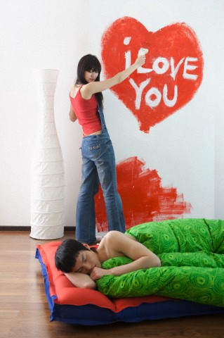 Woman painting heart