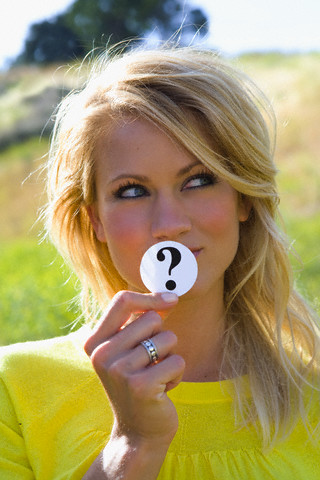Woman Holding Question Mark